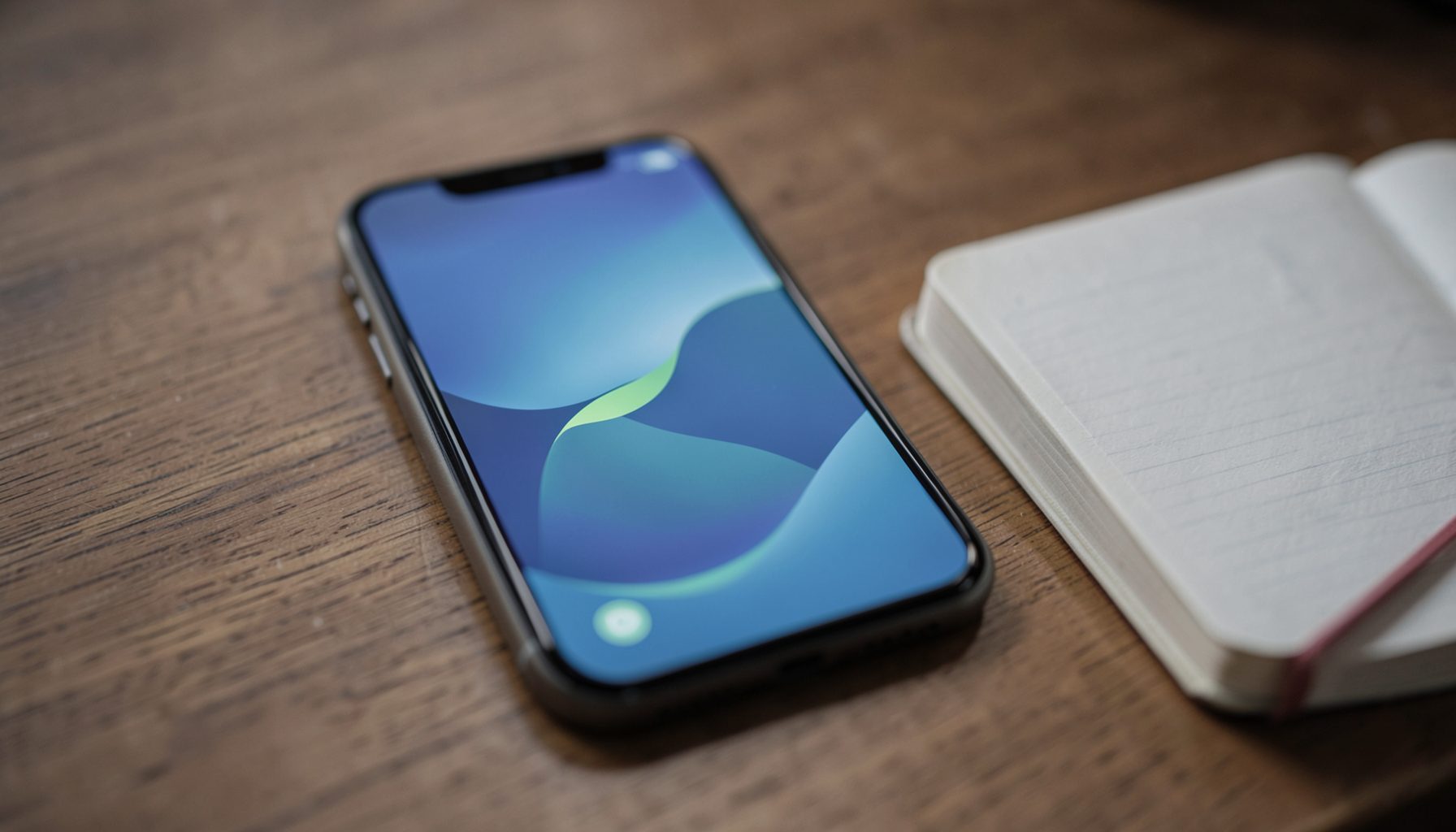 Soft navy and leaf green abstract image of a smartphone screen glowing gently on a wooden desk beside a notebook, quiet and focused mood